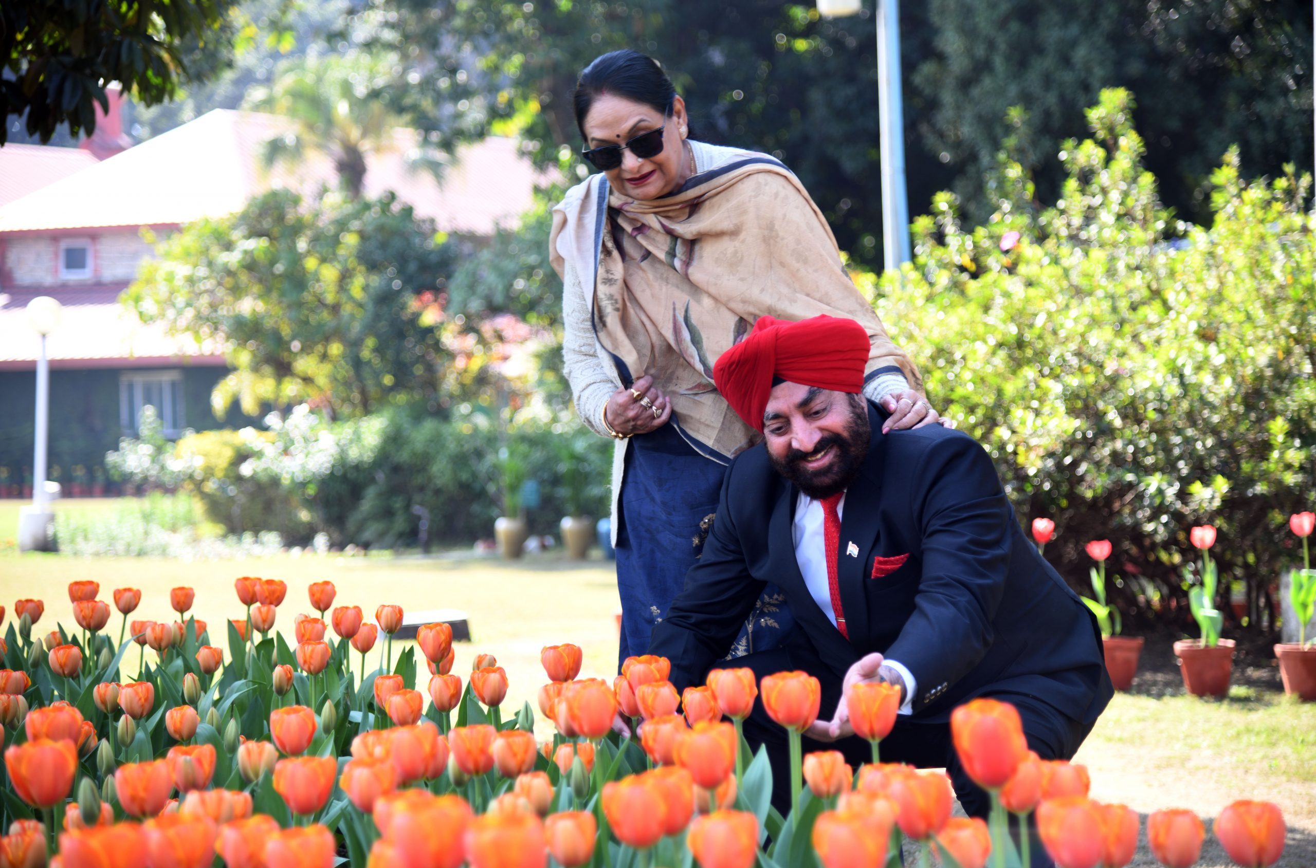 Governor and the first lady of the state Mrs. Gurmeet Kaur looking at the colorful Tulips blooming