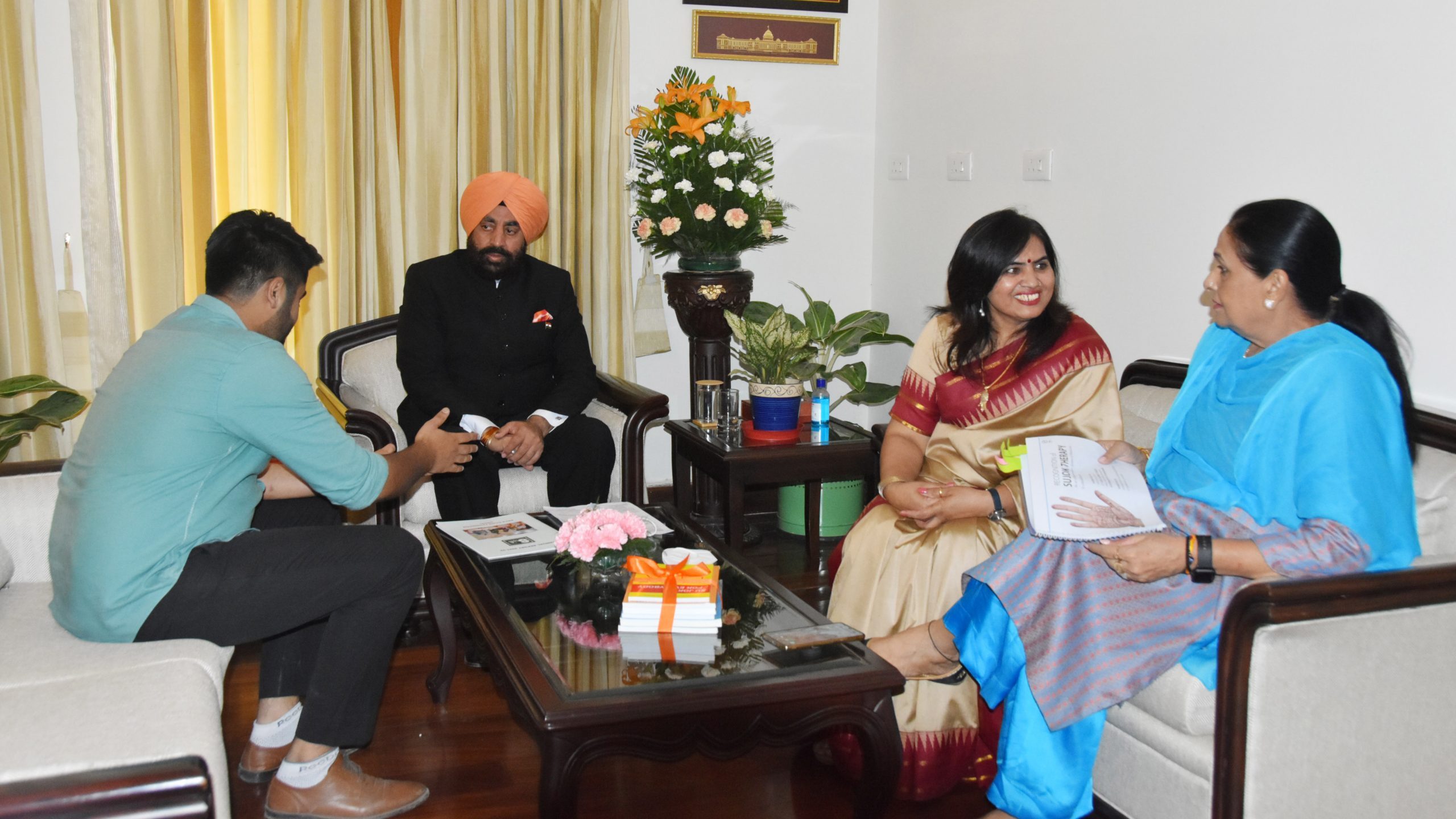Governor and First Lady while talking to the President of Uttarakhand Division of International Su-Joke Association, Mrs. Subhash Chaudhary and Gurmeet Chauhan .