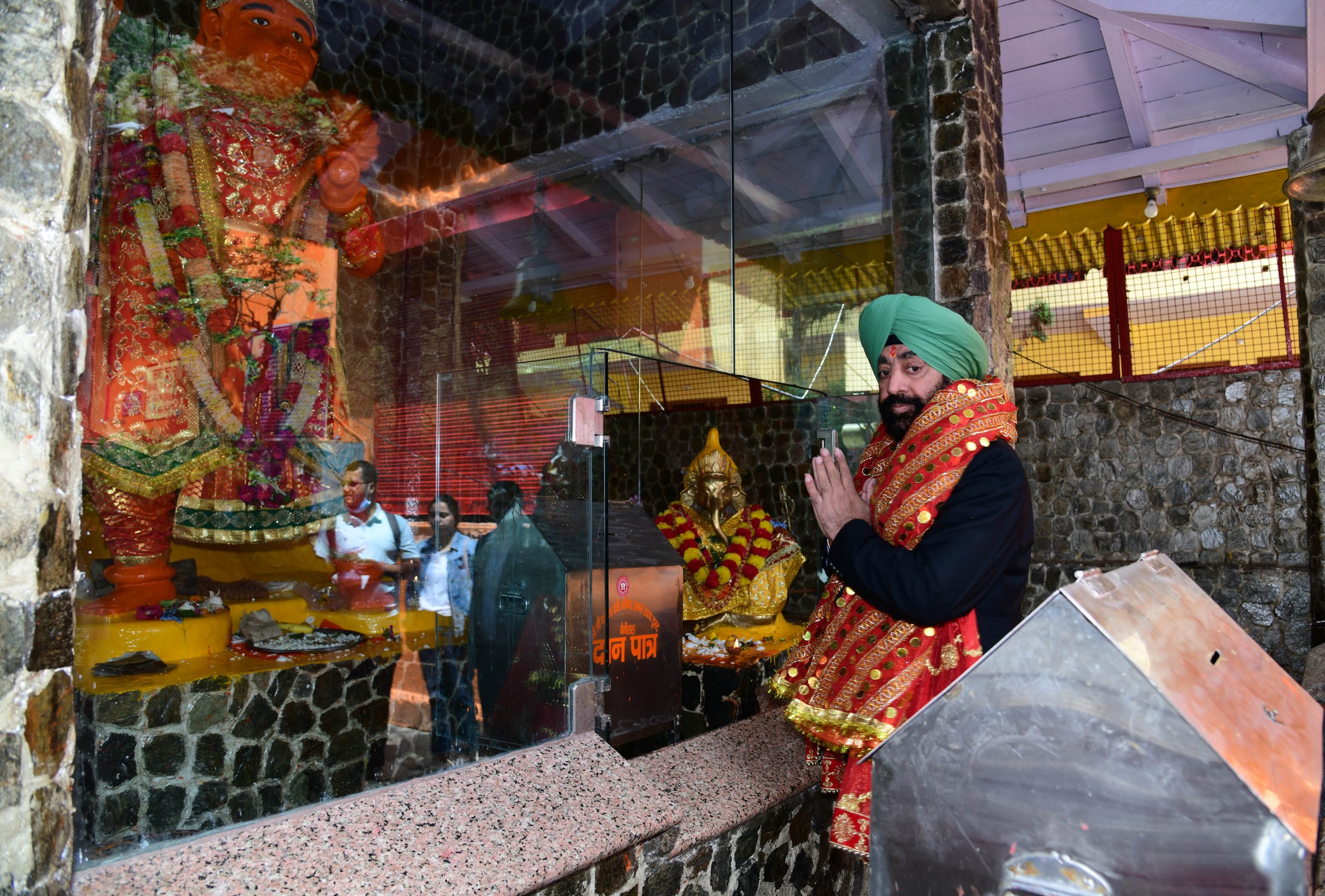 Governor offering prayers to family members at Maa Naina Devi Temple in Nainital.
