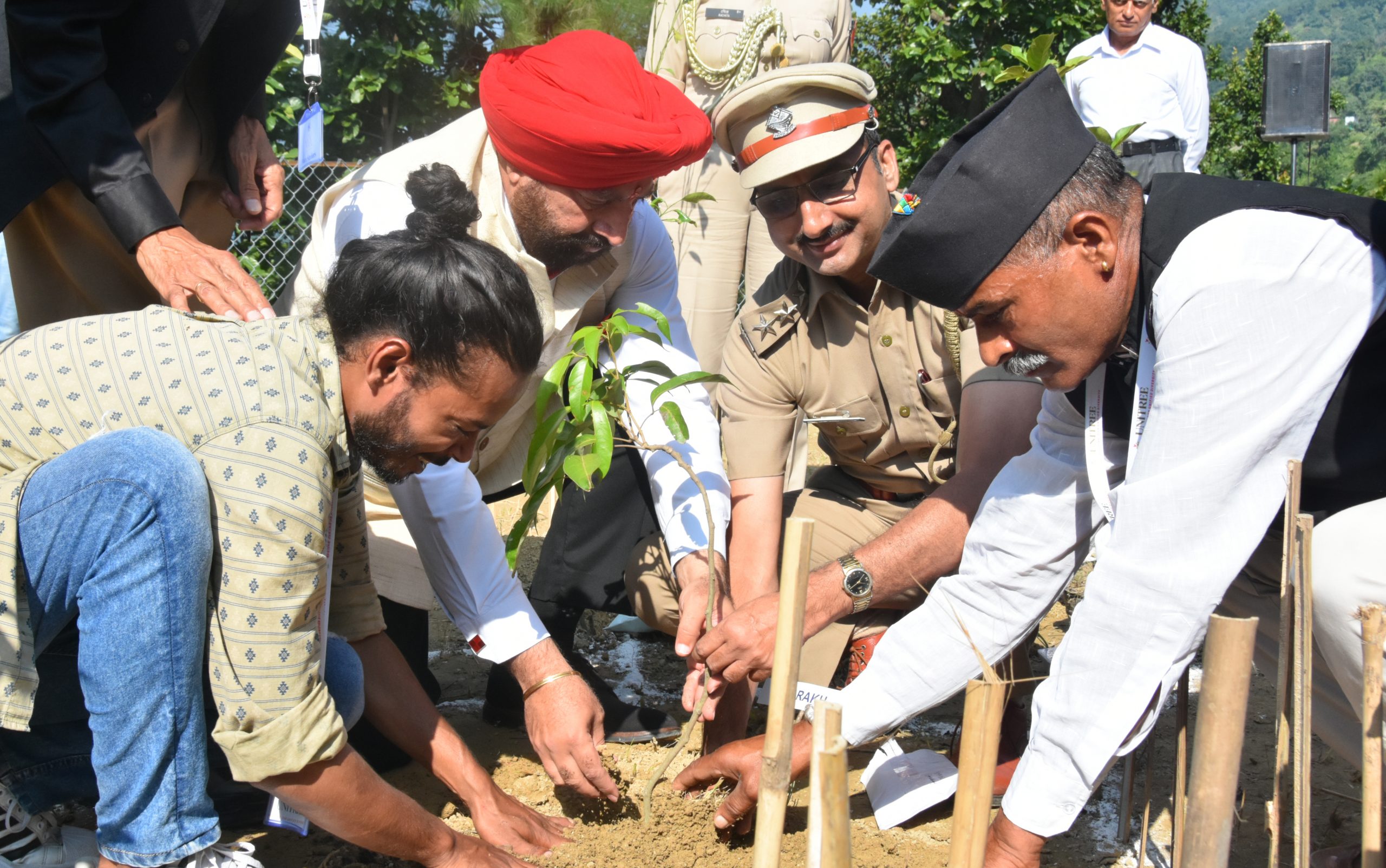 Governor participating in the Unitree plantation drive of The NVA Experience Institute in village Kimari.