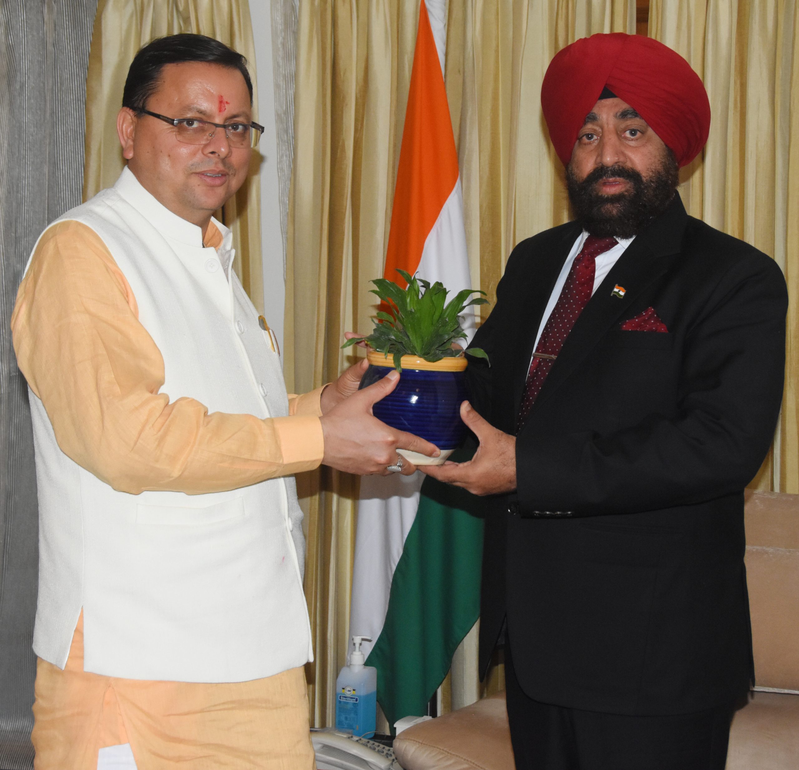 Chief Minister Pushkar Singh Dhami paying a courtesy call on the Governor.