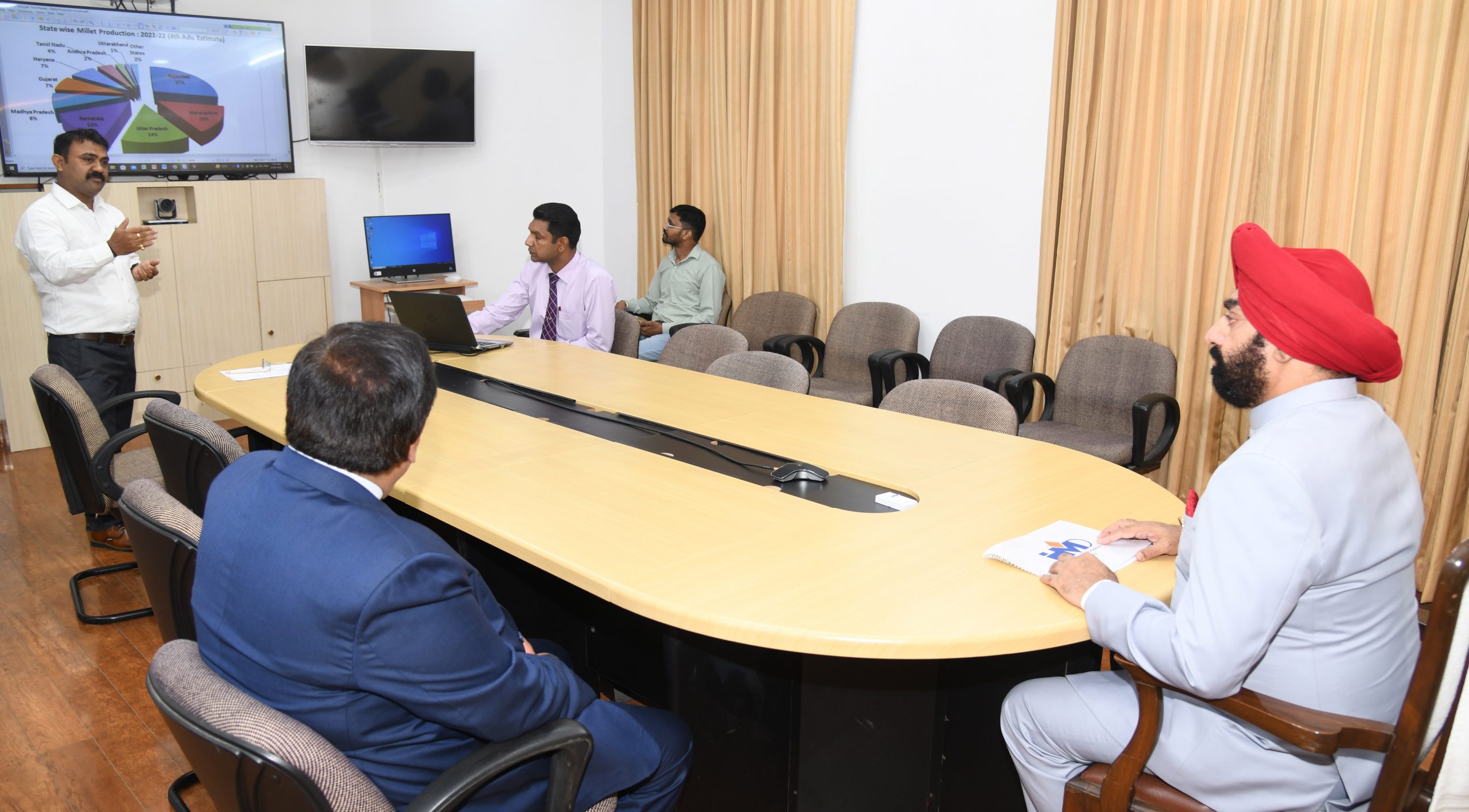 Principal of IHM Dehradun Dr. Jagdeep Khanna and HOD Food Production Manish Bharti give a presentation to Governor regarding the work being done on Millets.