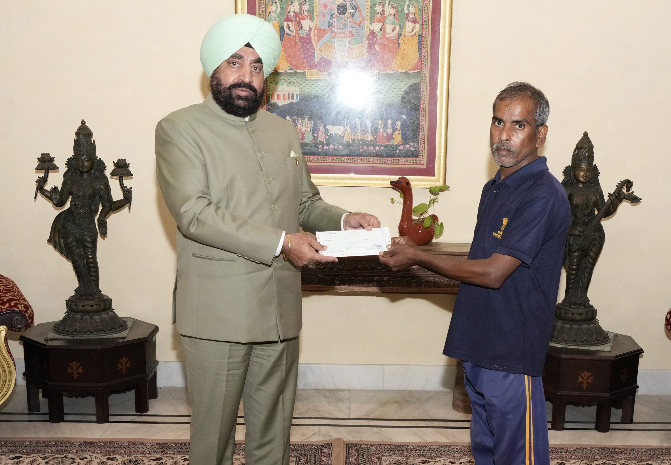 Governor Lt Gen Gurmit Singh (Retd) rewards the daily workers working in Raj Bhawan household establishment and garden