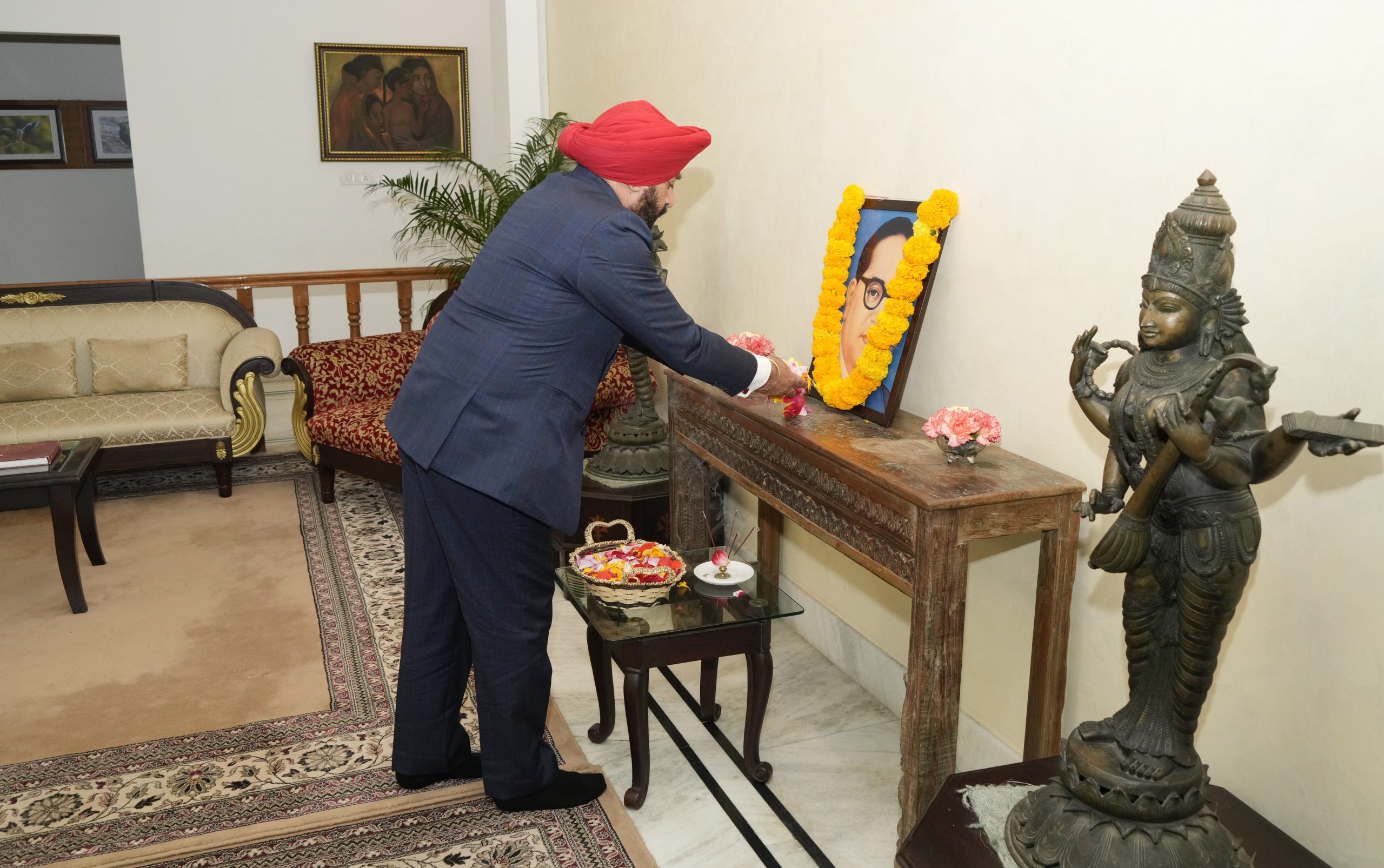 Governor Lt Gen Gurmit Singh (Retd) offering flowers on the portrait of Bharat Ratna Baba Saheb Dr. Bhimrao Ambedkar on his Mahaparinirvan Day.