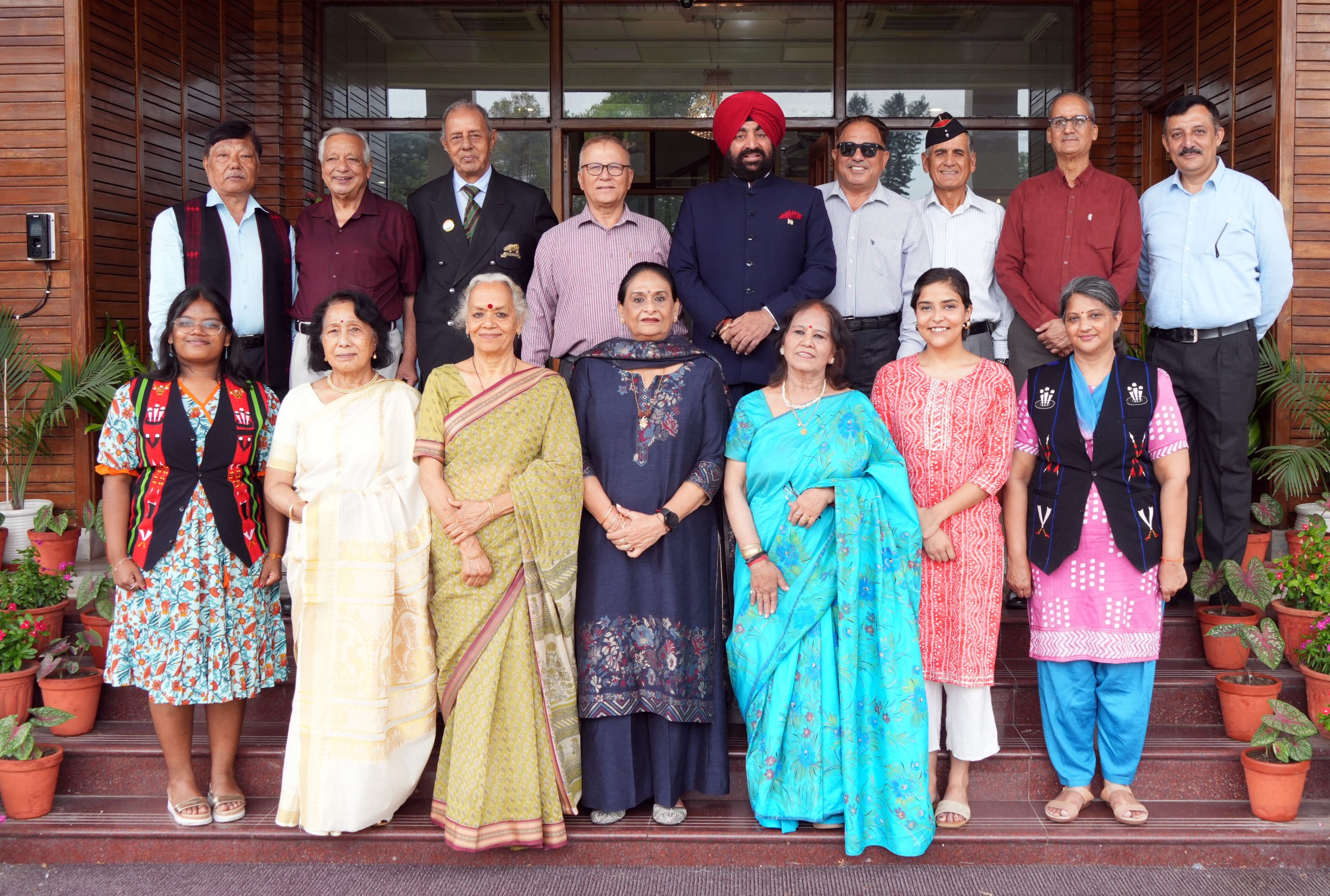Former soldiers of Assam Regiment and their families with the Hon'ble Governor.