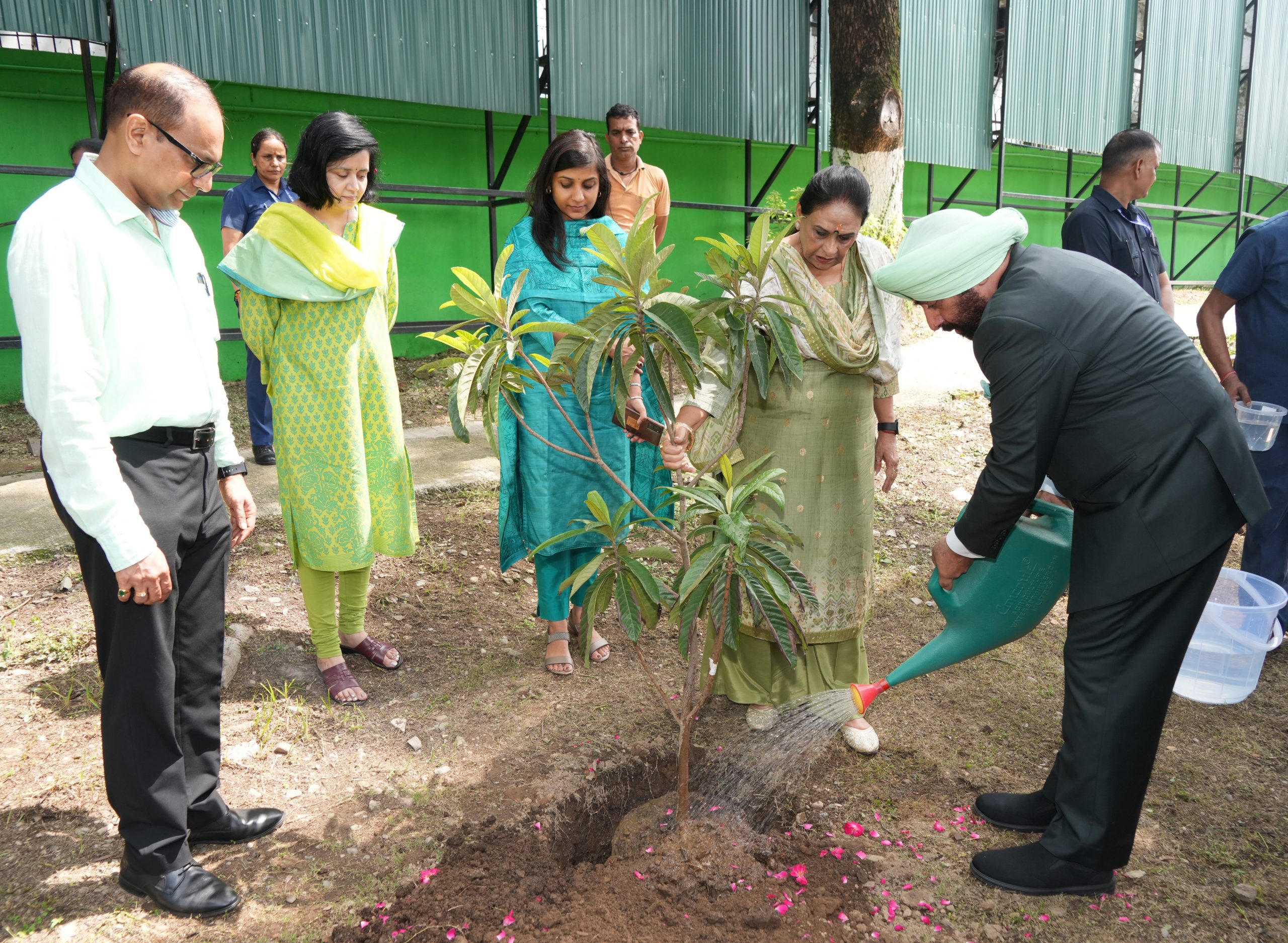 Hon'ble Governor planting a sapling in Raj Bhawan, on the occasion of Harela festival.