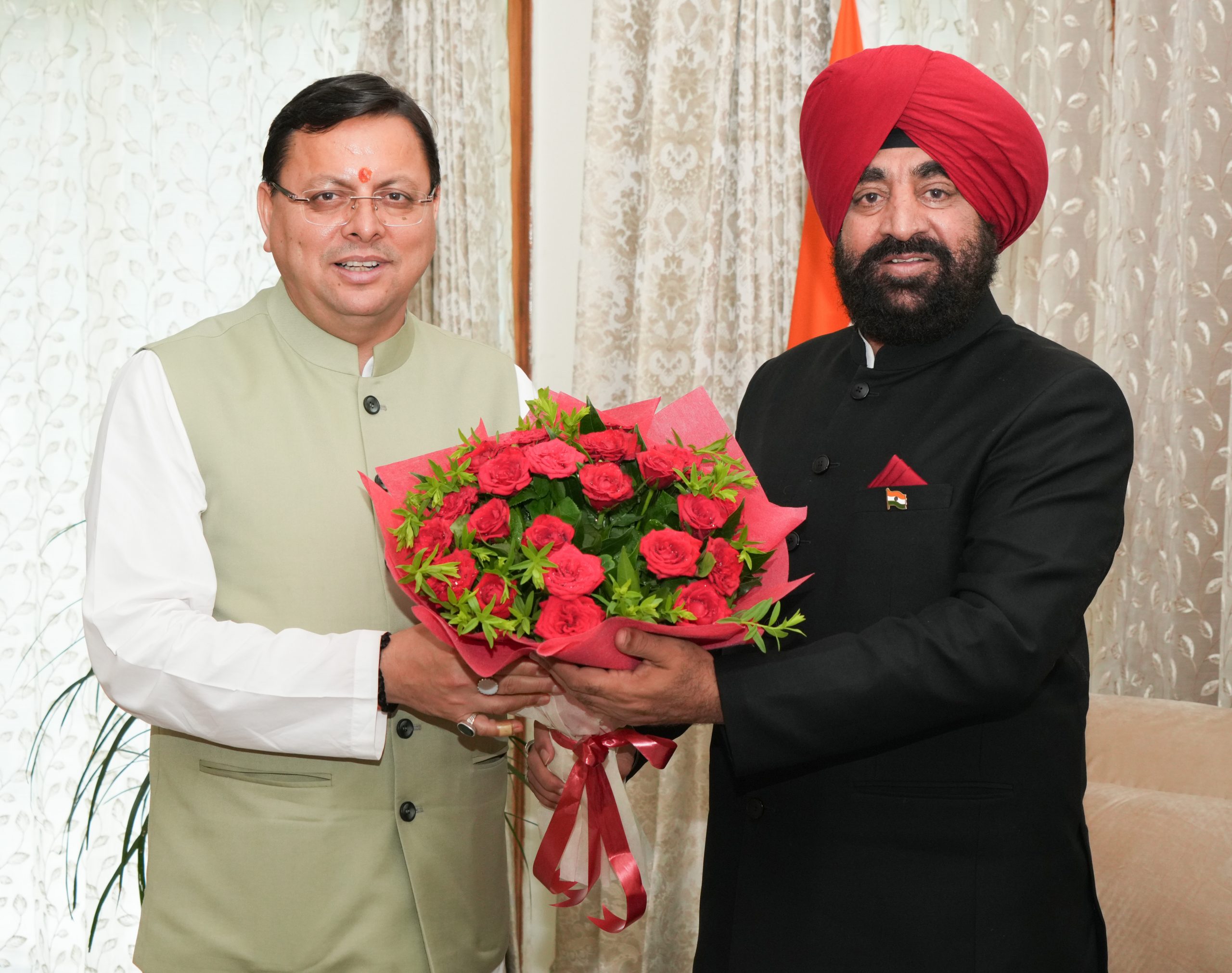Chief Minister, Shri Pushkar Singh Dhami paying a courtesy call on the Hon'ble Governor.