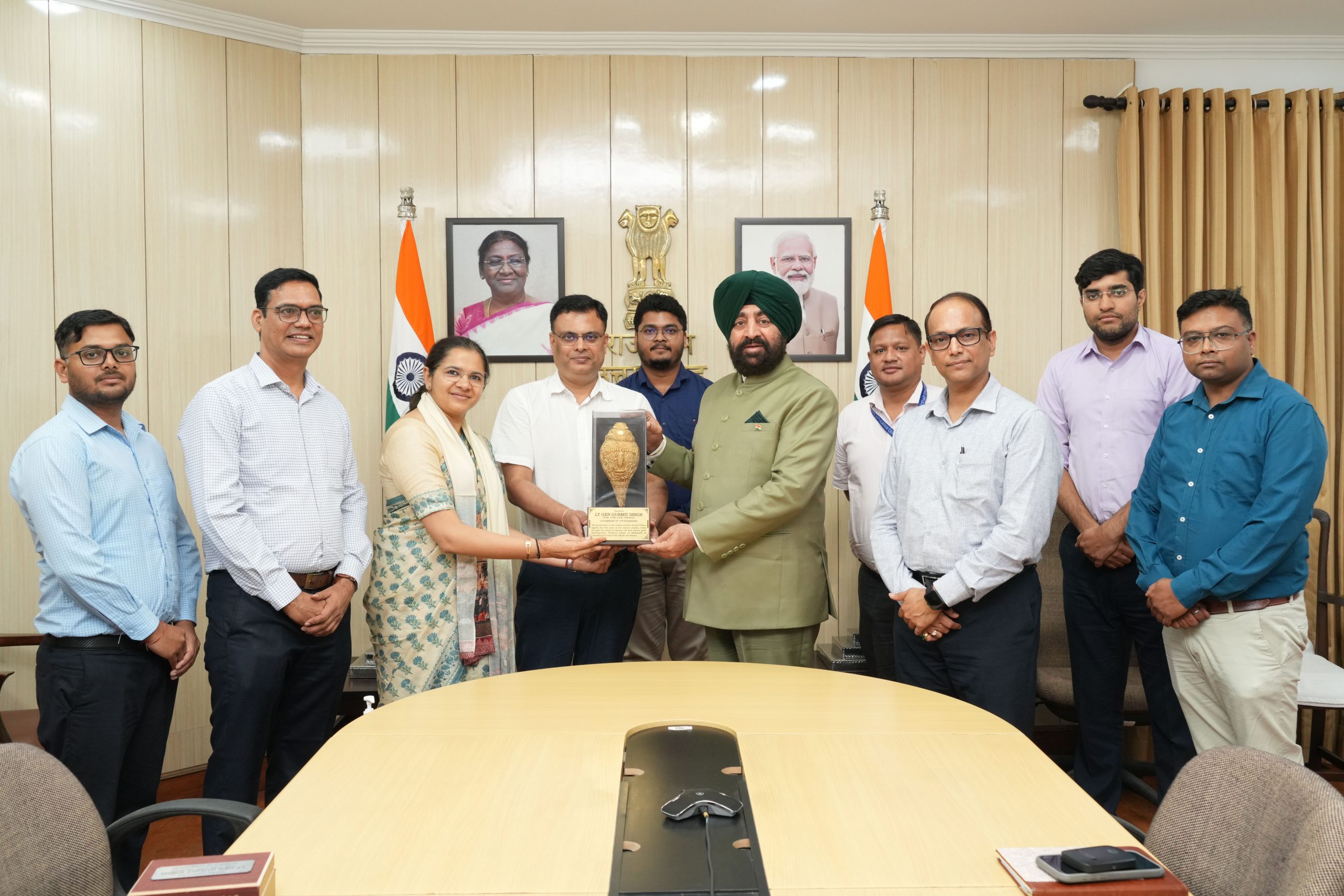 Hon'ble Governor presenting memento to ITDA officials.