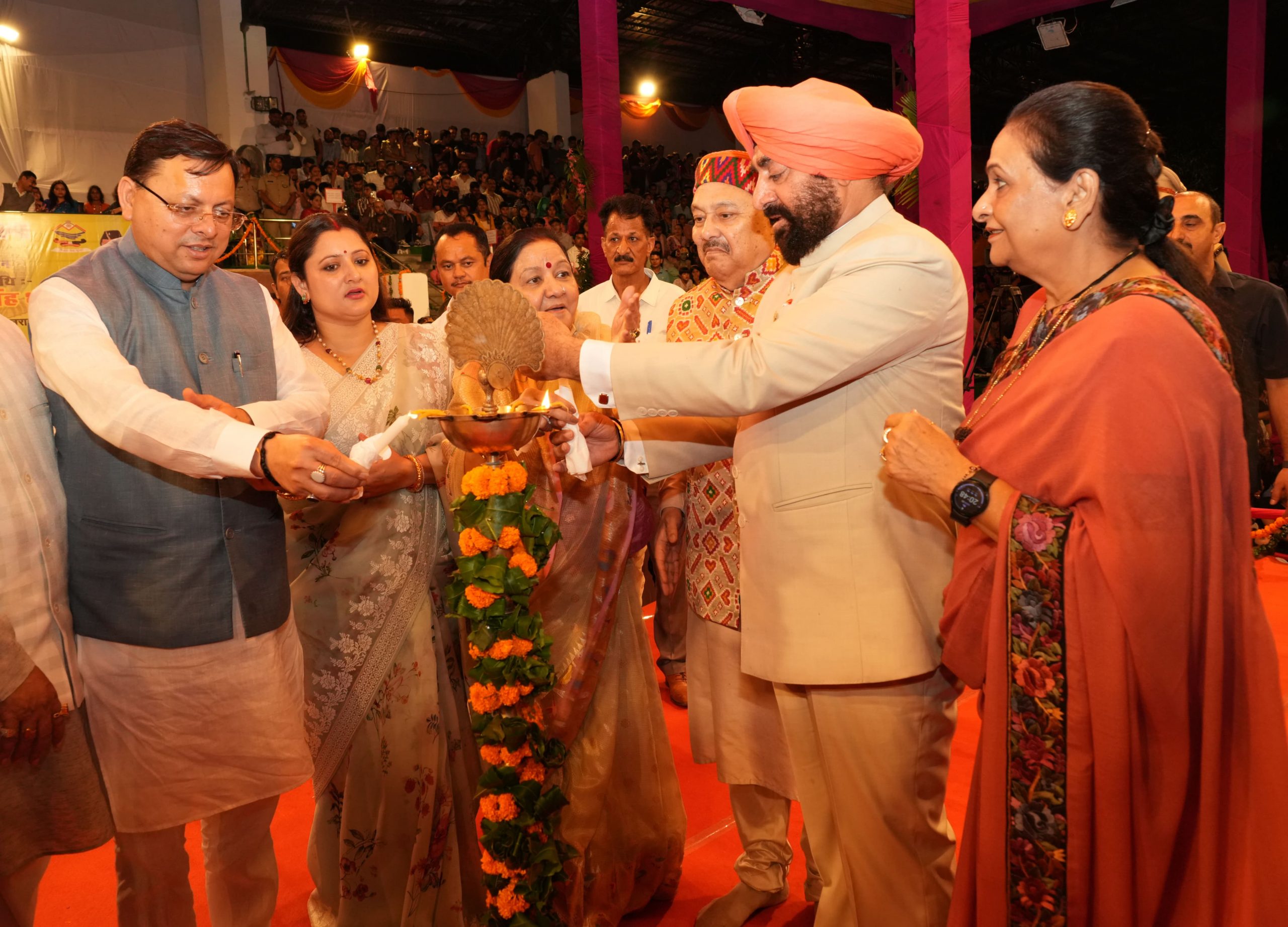 Governor and Chief Minister lighting the lamp at the program organized on the occasion of Shri Krishna Janmashtami at Police Line, Dehradun.