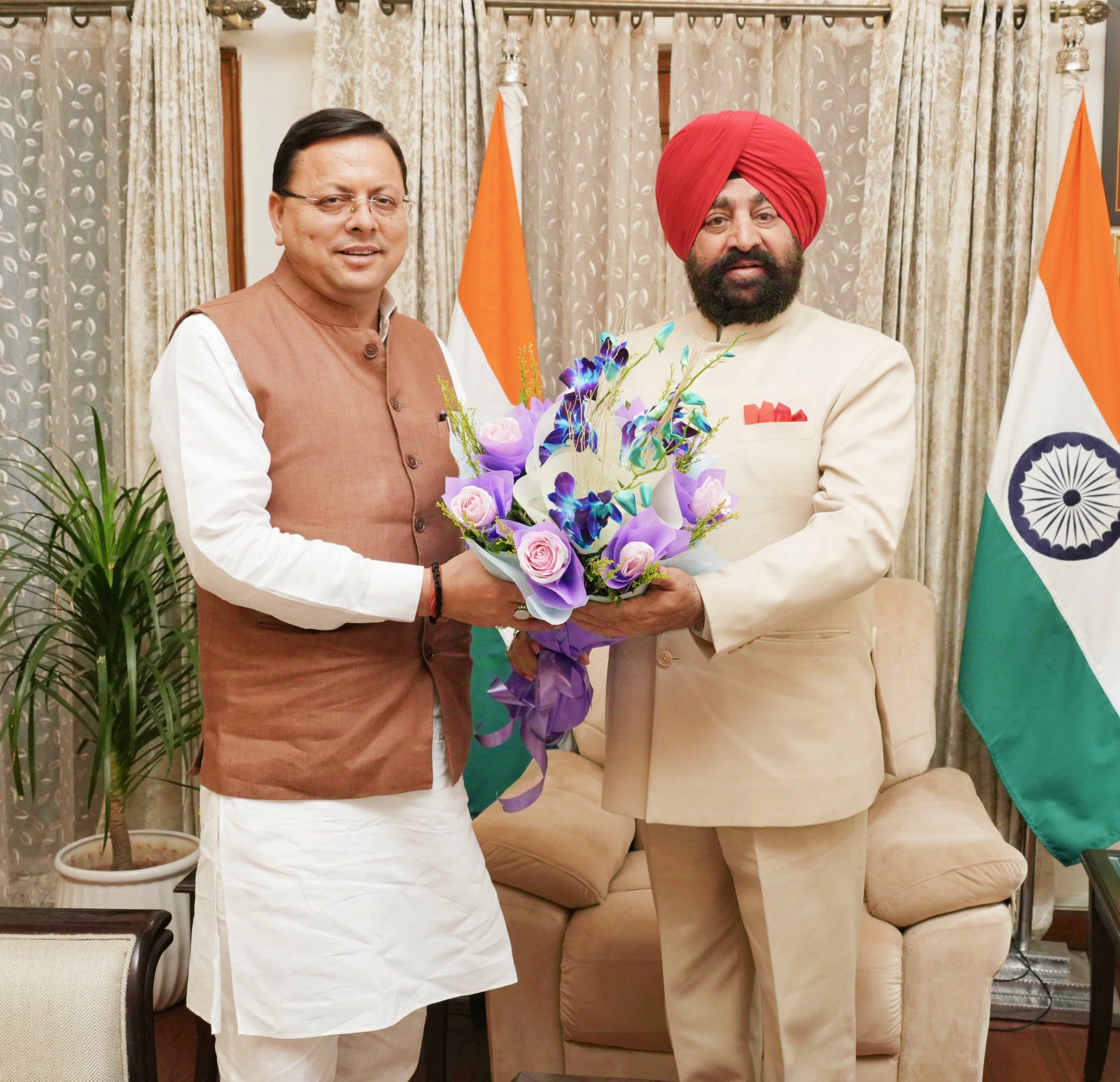 Chief Minister Shri Pushkar Singh Dhami paying a courtesy visit to the Governor.