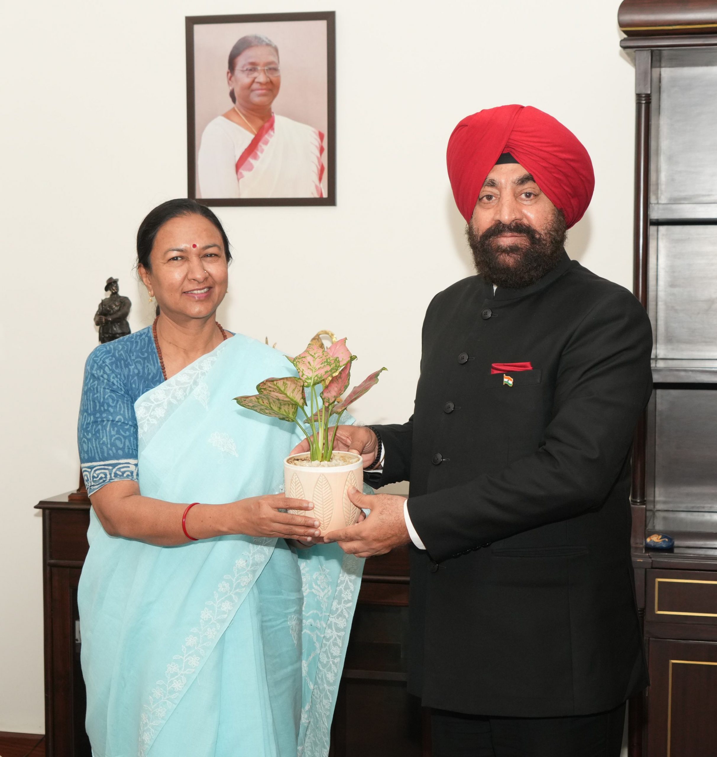 Chief Secretary Mrs. Radha Raturi paying a courtesy call on the Governor.