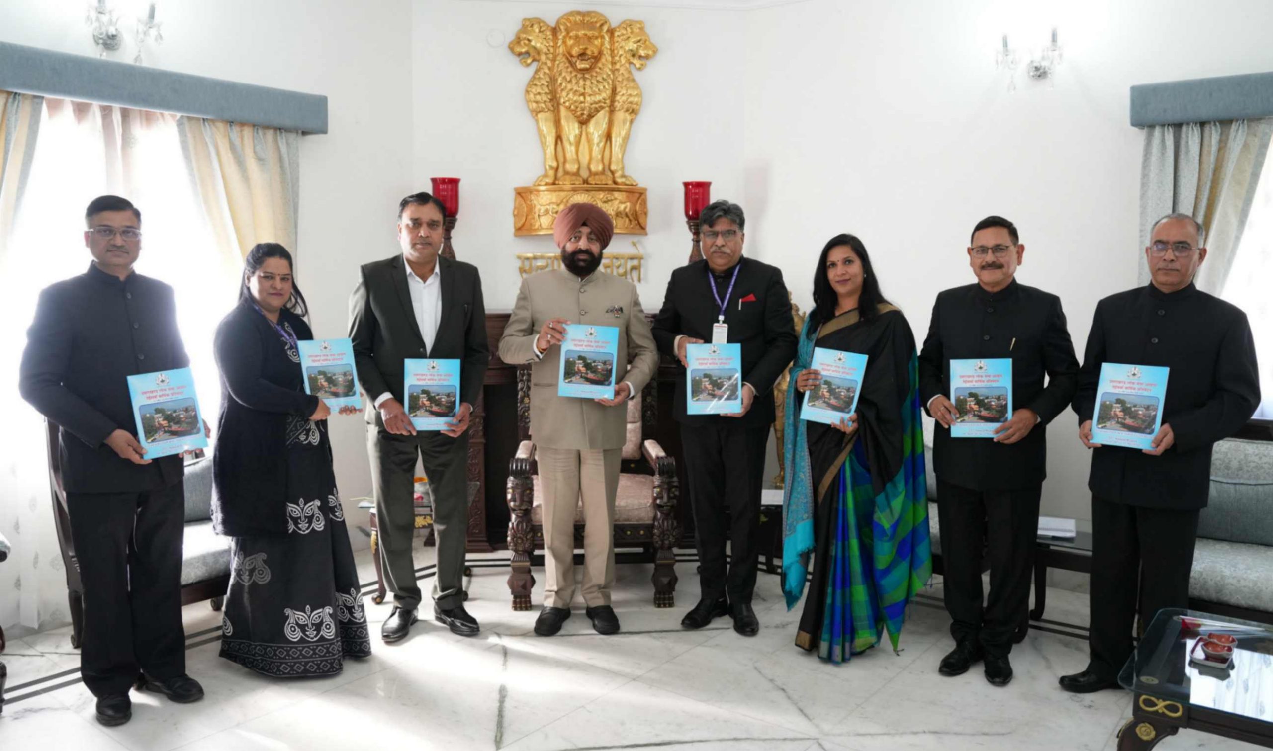 UPSC Chairman Dr. Ravi Dutt Godiyal and other members of the Commission presenting the 23rd annual report of the Commission to the Governor.