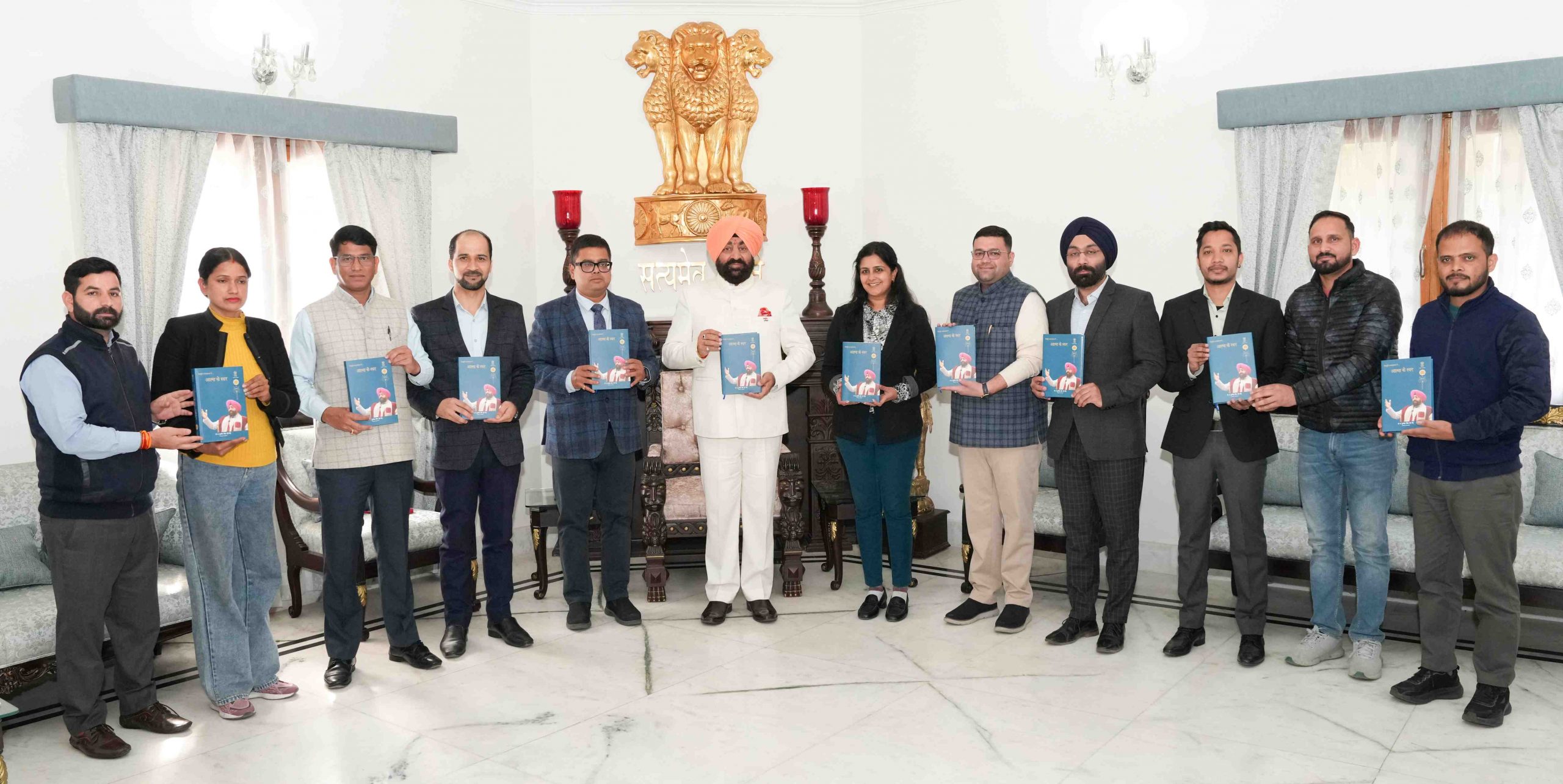 The Governor releasing the book 'Atma Ke Swar' Volume-3 at Raj Bhawan.