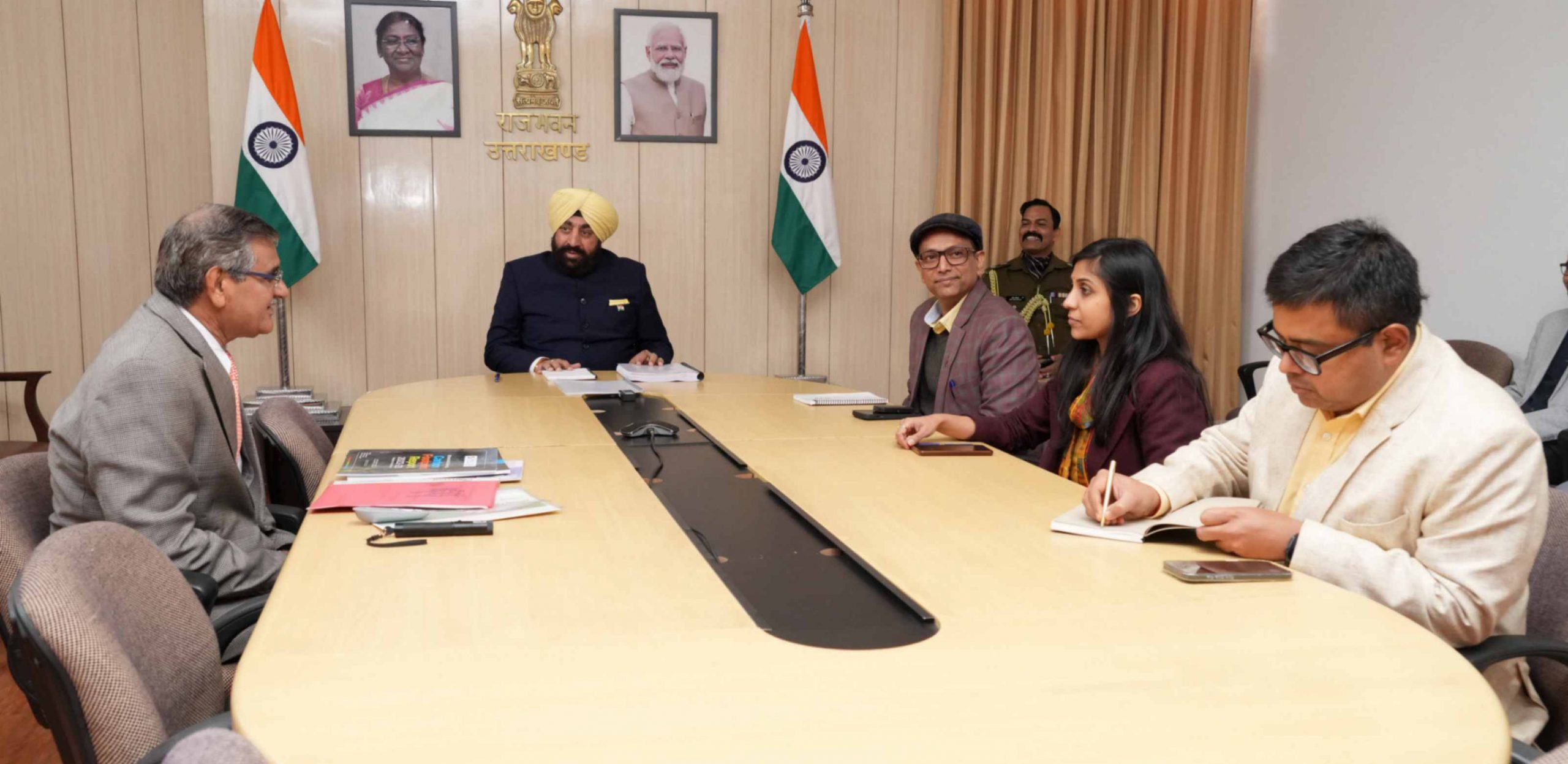 Uttaranchal University Vice Chancellor Prof. Dharmabuddhi giving a presentation on the progress of research work under the “One University-One Research” before the Governor.