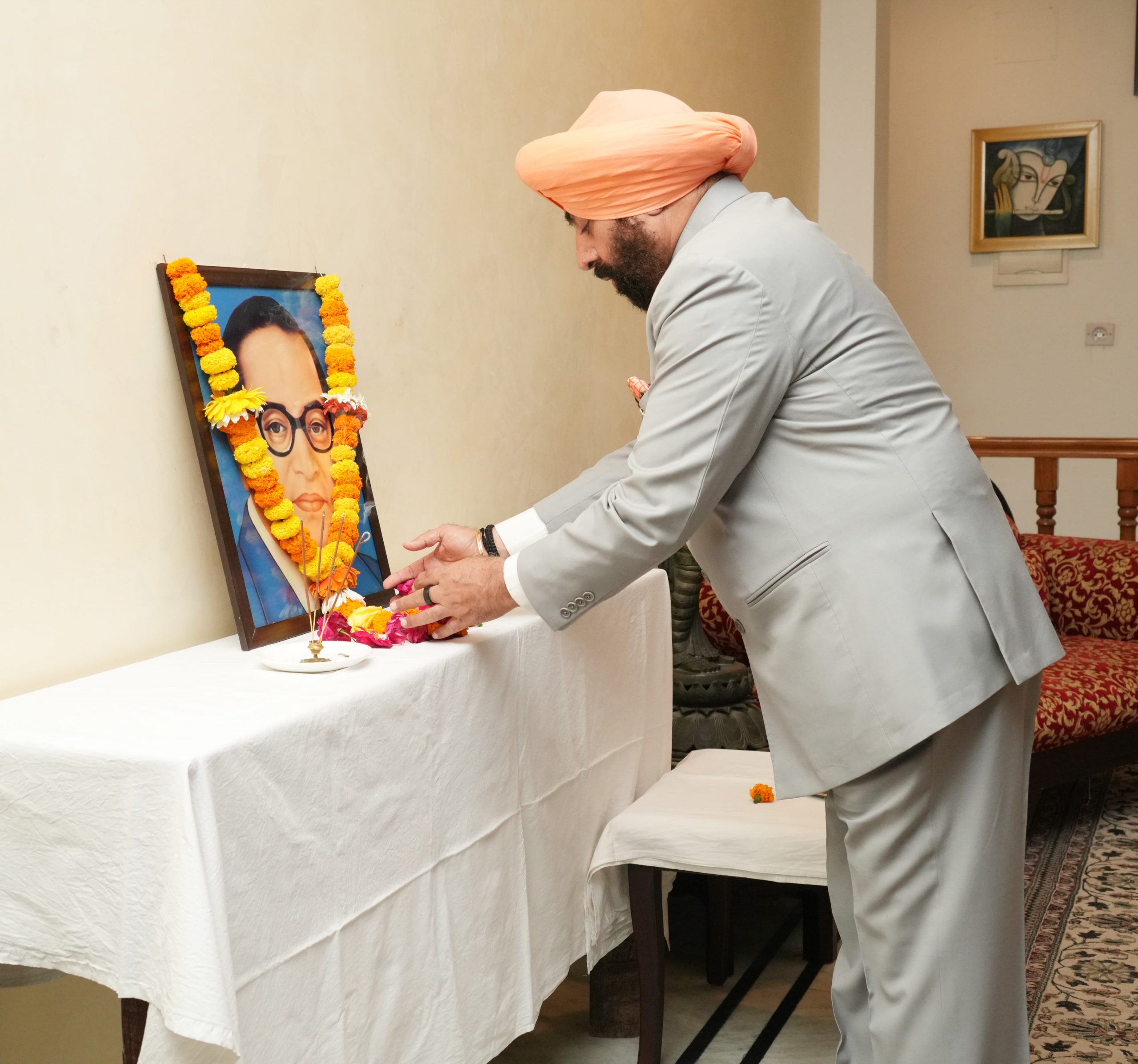 The Governor paying emotional homage to Bharat Ratna Dr. Bhimrao Ambedkar by laying floral wreath on his portrait on the occasion of his birth anniversary.