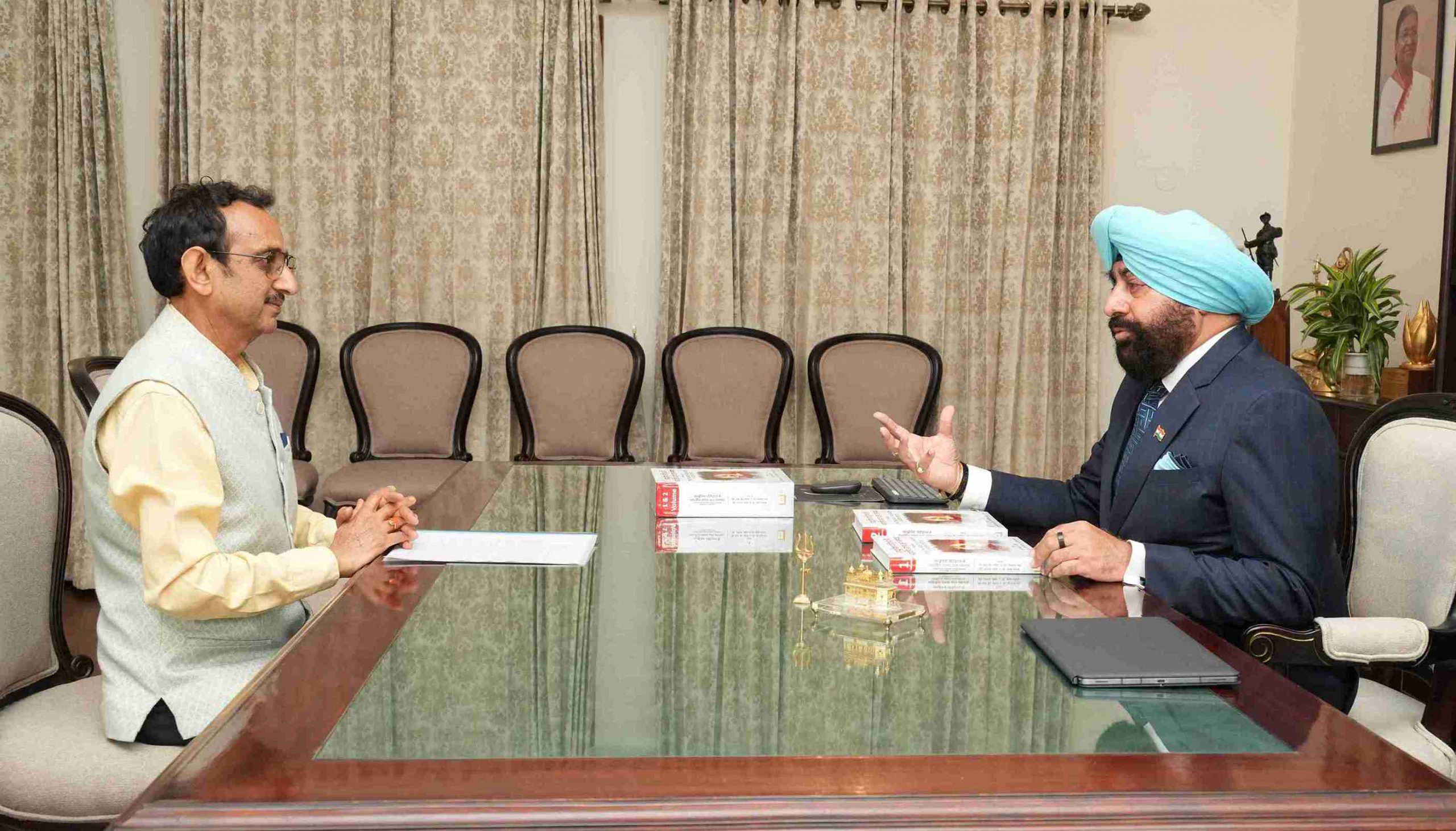 Vice Chancellor of Shridev Suman Uttarakhand University, Prof. N. K. Joshi in conversation with the Governor.
