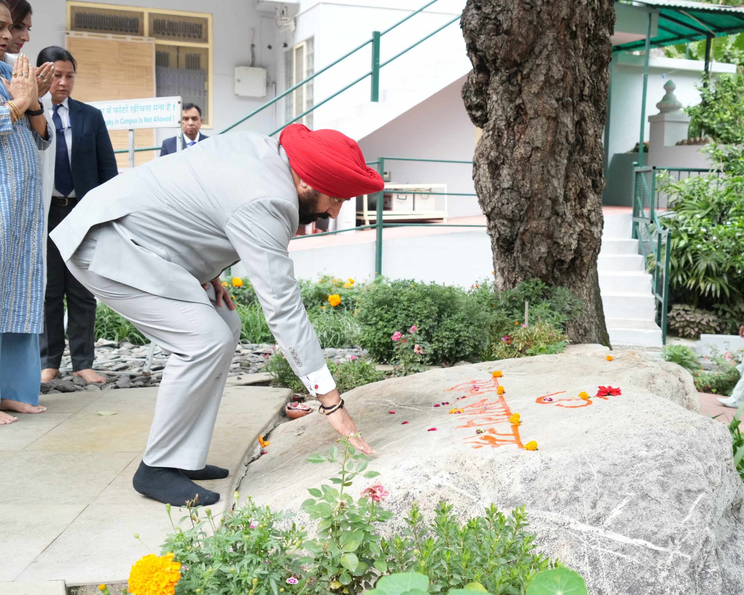 Governor and First Lady Mrs. Gurmeet Kaur paying homage to Baba Neem Karori Maharaj at Shri Kainchi Dham, the ultimate center of supernatural power and spiritual energy, located in Nainital.