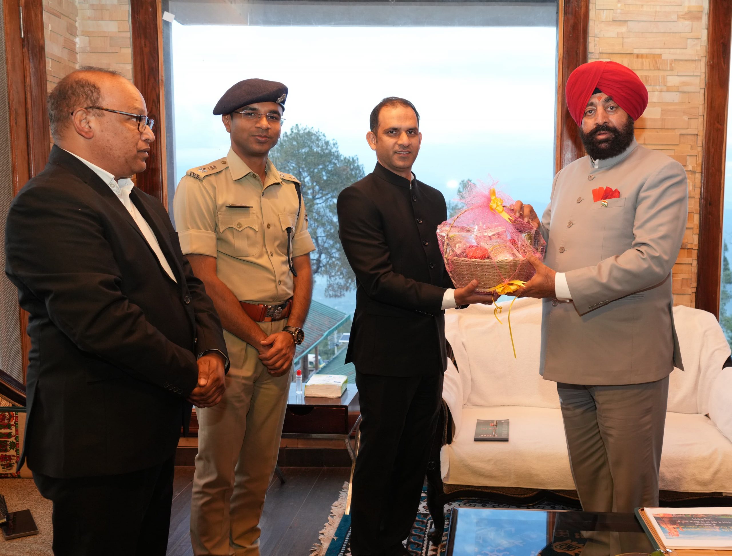 District Magistrate Ashish Bhatgain welcoming the Governor on his arrival at the guest house of Kumaon Mandal Vikas Nigam in Kausani.