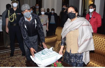 Governor distributed relief material to boat drivers, rickshaw drivers and coachmen.