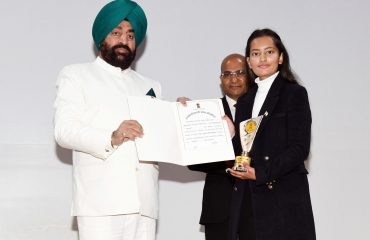 Governor felicitating the winning students in the Inter-University Speech Competition program on the theme 