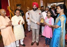 Governor Lt Gen Gurmeet Singh (R) felicitating the winning participant of the National Painting Competition, at Raj Bhawan;?>