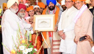 Officials of Shri Hemkund Sahib Trust presenting a memento.