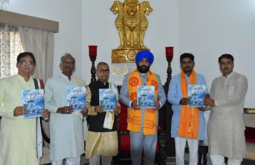 Governor releasing the annual magazine 'Sanskrit Surabhih' of Sanskrit Bharati.
