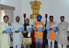 Governor releasing the annual magazine 'Sanskrit Surabhih' of Sanskrit Bharati.;?>