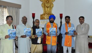 Governor releasing the annual magazine 'Sanskrit Surabhih' of Sanskrit Bharati.