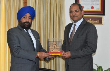 Governor presenting a memento to Mr. Viraj Singh, Ambassador to Tajikistan at Raj Bhawan.