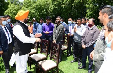 Governor meeting employees during Chhabeel program organized on the occasion of Martyrdom Day at Raj Bhavan.