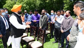 Governor meeting employees during Chhabeel program organized on the occasion of Martyrdom Day at Raj Bhavan.