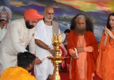Governor inaugurating the program organized on the occasion of 70th birth anniversary celebrations of Pujya Swami Chidanand Saraswati Ji Maharaj at Parmarth Niketan by lighting the lamp.;?>