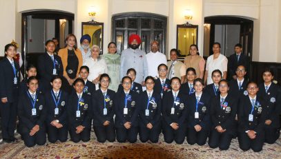 Governor Lt Gen Gurmeet Singh (S) with girl students of St. Mary's Convent College, Ramani, Nainital at Raj Bhavan Nainital.