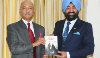 Former DGP Anil Raturi presenting his book “Bhanwar: Ek Prem kahani” to Governor Lt Gen Gurmit Singh (Retd).