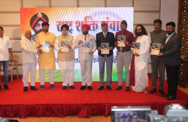 Governor Lt Gen Gurmit Singh (Retd) releasing the book on the occasion of 'Rashtra Shakti Samvad' program of Shaheed Samarsata Mission, in Indore, Madhya Pradesh.