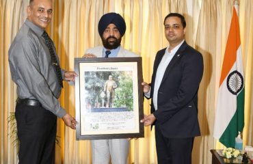 Dehradun Cantt Board Chairman Anirban Dutta and CEO Abhinav Kumar presenting a photo of Bharat Ratna Dr. Bhimrao Ambedkar to the Governor.