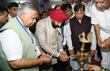 Governor inaugurating the All India Agrawal Conference by lighting the lamp at Bhupatwala, Haridwar.