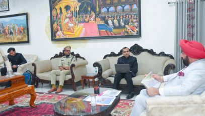Governor chairing a meeting with administrative officials, at Rudraprayag.
