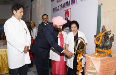 Governor inaugurating the Trauma Week program by lighting the lamp on the occasion of 'World Trauma Day' at AIIMS Rishikesh.