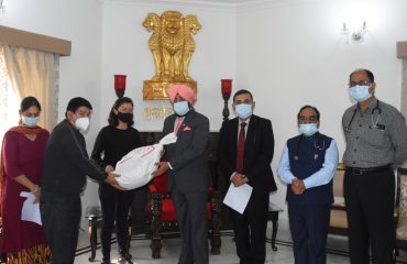 Governor distributing monthly nutrition kits to tuberculosis patients under Tuberculosis (TB) disease public awareness campaign at Raj Bhawan.