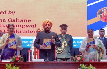 Governor releasing the book on the occasion of two-day international seminar organized at Doon University.
