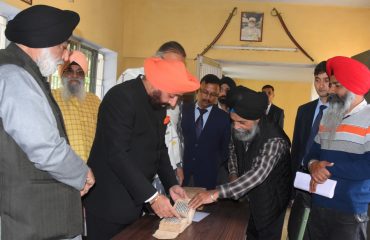 Governor taking information about Sikh literature on the occasion of 150th birth anniversary of 'Bhai Veer Singh ji' organized by Punjabi University at Dr. Balbir Singh Sahitya Kendra located at Pritam Road.