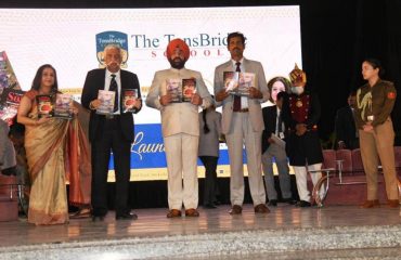 Governor releasing the book on the occasion of a program organized at Tons Bridge School, Nanda Ki Chowki