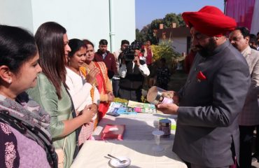 Governor Lt. Gen. Gurmit Singh (from R) commends the effort and creativity for the wide array of products handcrafted by women.