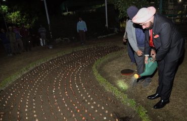 Governorplants the 400th tulip bulb at Raj Bhawan.