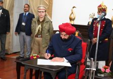 Governor Lt. Gen. Gurmit Singh (Retd) administers the oath of office and secrecy to the newly appointed State Information Commissioner;?>