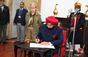 Governor Lt. Gen. Gurmit Singh (Retd) administers the oath of office and secrecy to the newly appointed State Information Commissioner