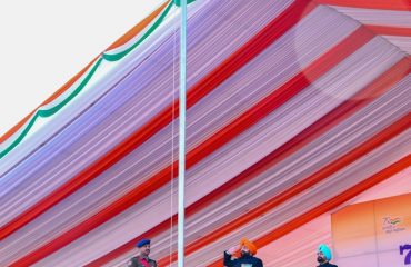 Governor hoisting the tricolour and saluting the national flag at the Republic Day function at Parade Ground.