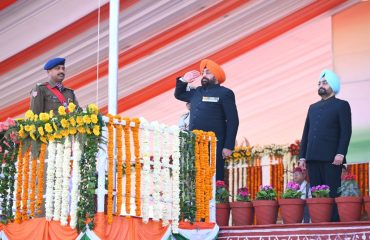 Governor hoisting the flag and saluting the national flag at the Republic Day function at Parade Ground.